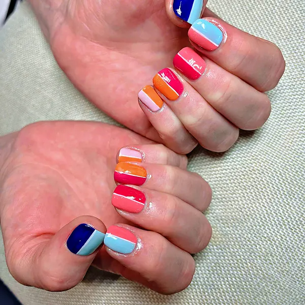 Colour block nails in pink, orange, navy and blue by Sandy Hill Spa
