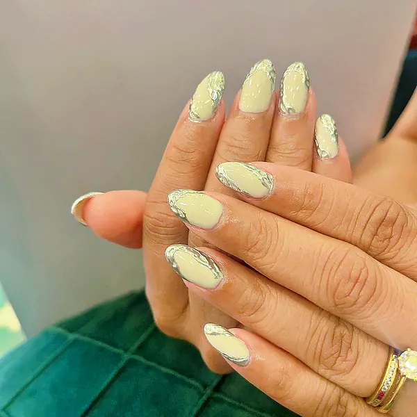 Nude almond nails with silver chrome lines by Sandy Hill Spa