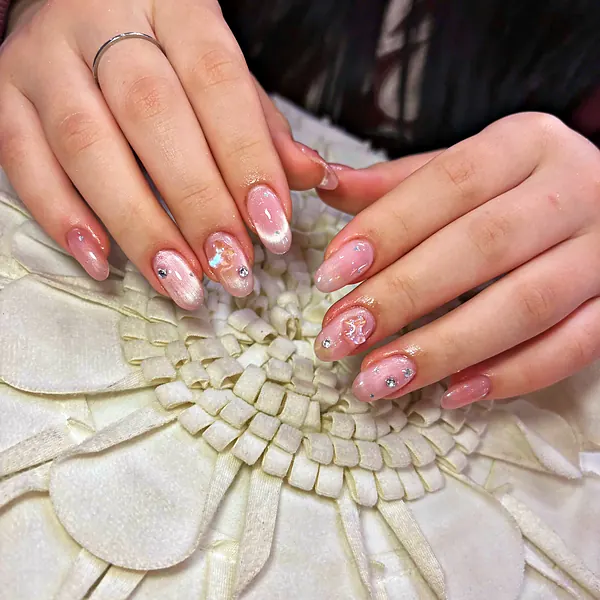 Pink marble almond nails with crystals by Sandy Hill Spa