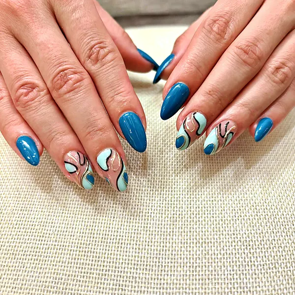 Teal almond nails with swirl art by Sandy Hill Spa